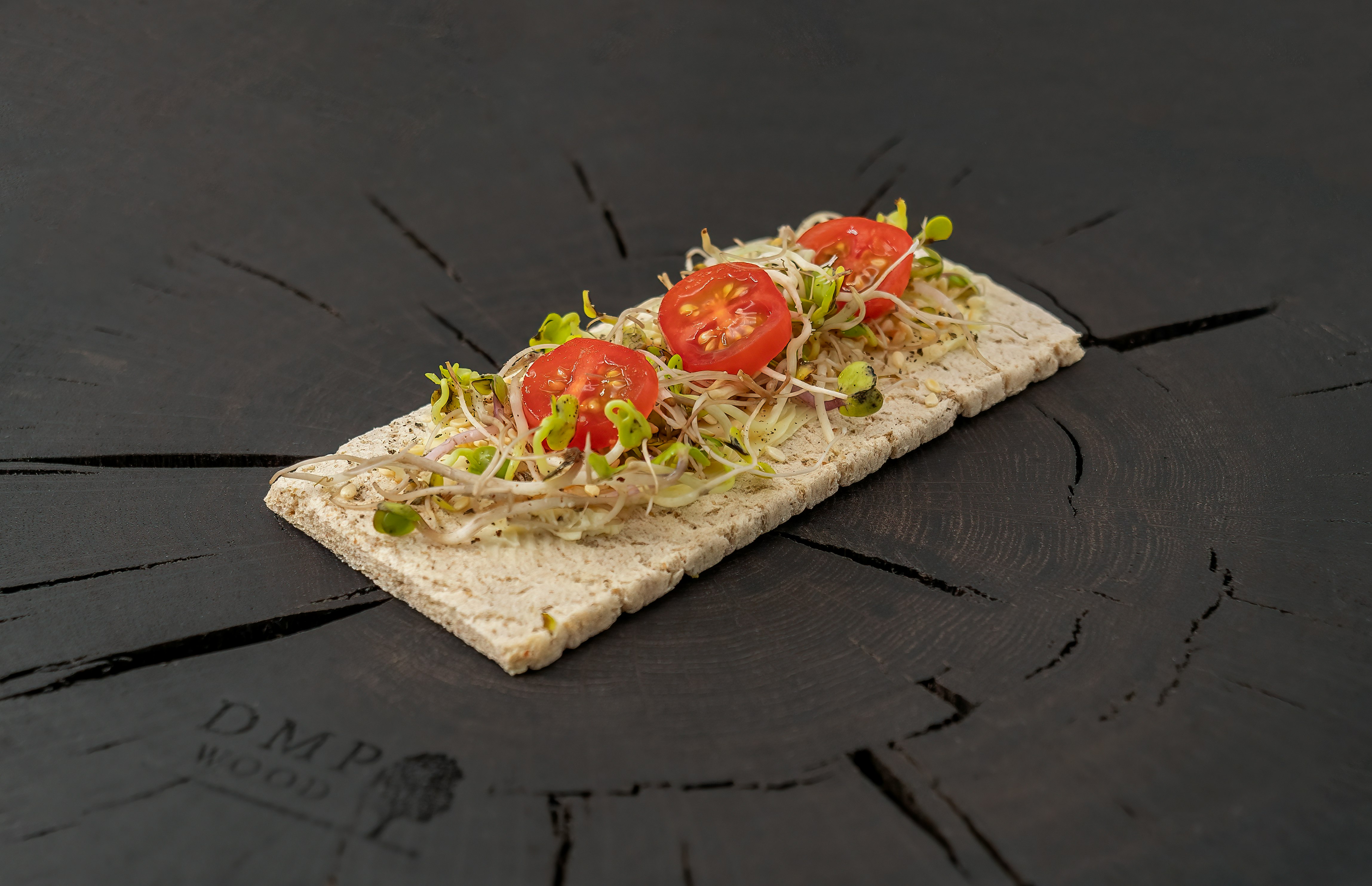 brown bread with tomato and green leaf vegetable